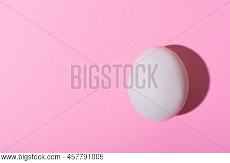 Creative Happy Easter, Food Card, Egg White Shell On A Pink Background.