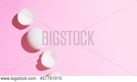 Creative Happy Easter, Food Card, Egg White Shell On A Pink Background.