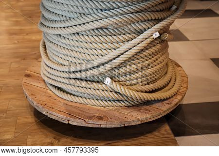 A Drum With A Coiled, Wound Rope, A Rope.