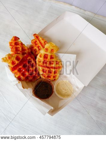 Croissant Waffle Or Croffle With Chocolate Sauce Served In Box And White Background