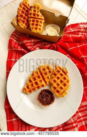 Croissant Waffle Or Croffle With Chocolate Sauce Served In Box And White Background