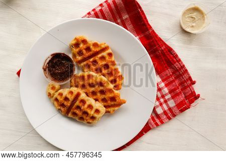 Croissant Waffle Or Croffle With Chocolate Sauce Served In Box And White Background