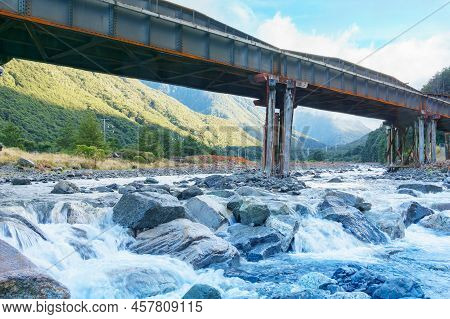 Silhouette Of Structure Of Railway Bridge Across Bealey River At Arthurs Pass, South Island New Zeal