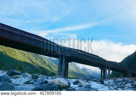 Silhouette Of Structure Of Railway Bridge Across Bealey River At Arthurs Pass, South Island New Zeal