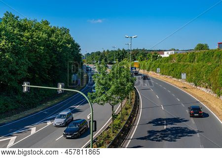 Segment Of Highway In The Suburbs Of A European City. Sparse Traffic In Both Directions.