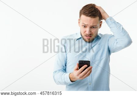 A Man With A Smartphone Is In A Panic Due To The Fall Of The Cryptocurrency Market. Inflation Has Br