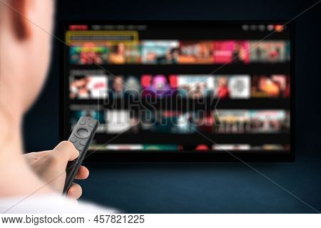 Man Relaxing At Home In Evening And Watching Tv. Multimedia Streaming Concept. Vod Content Provider.