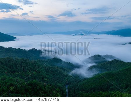 Dense Low Fog Flows Into Valley At Dawn