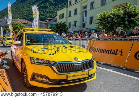 Aigle, Valais Canton, Switzerland -10.07.2022: Passage Of An Advertising Car Of Yellow Jersey Lcl In