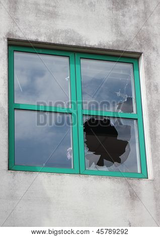 Broken Glass In Window With Green Frame At  Factory