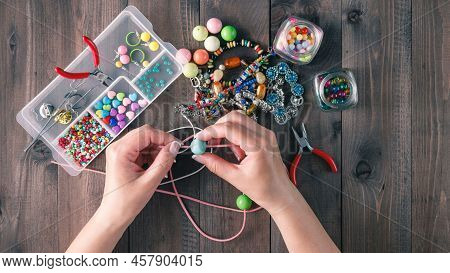 Making Handmade Bracelet With Old Jeweller A Young Women Collects Different Collection Of Small And 