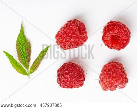Ripe Raspberries With Leaves Isolated On White Background