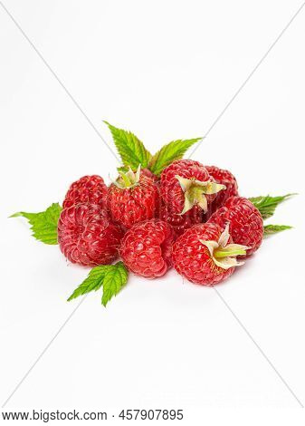 Ripe Raspberries With Leaves Isolated On White Background