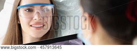 Portrait Of Patient On Dental Consultation In Clinic, Doctor Examine Teeth X Ray On Digital Tablet D