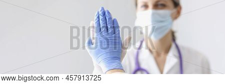 Portrait Of Medical Coworkers Give High Five After Successful Surgery Or Diagnose To Patient. Good J
