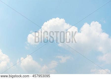 Summer Blue Sky And Clouds. Gradient Blue And Light White Background. Beauty Clear Cloudy In The Sun