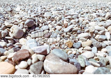 Vacation By The Sea On The Beach. Pebble Beach With Stones. Sandy Texture, Natural Natural Backgroun
