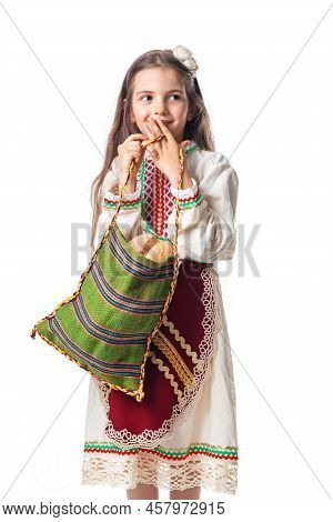 Bulgarian Woman  Or Young Girl In Traditional Folklore Dress Holds In Hands Golden Wheat And Freshly