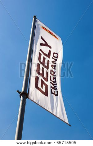 Samara, Russia - May 25, 2014: The Flag Of Geely Over Blue Sky. Geely Is A Chinese Automotive Manufa