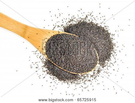 A heaped spoonful of organic poppy seeds on a white background