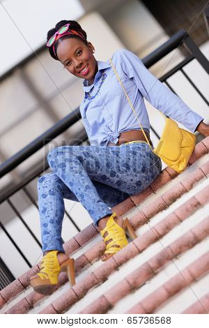 Stock model sitting on a staircase