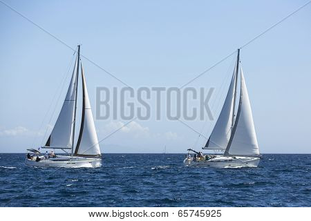 AEGEAN SEA, GREECE - APR 29, 2014: Unidentified sailboats participate in sailing regatta 