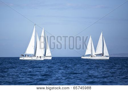 AEGEAN SEA, GREECE - APR 28, 2014: Unidentified sailboats participate in sailing regatta 