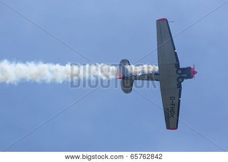BERLIN, GERMANY - MAY 20, 2014: The aircraft Red Bull Noorduyn AT-16 D-FHGK demonstration during the International Aerospace Exhibition ILA Berlin Air Show-2014.