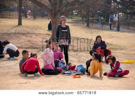 Tourists watch flowers in the park