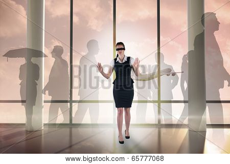 Redhead businesswoman in a blindfold against airplane flying past window at sunrise