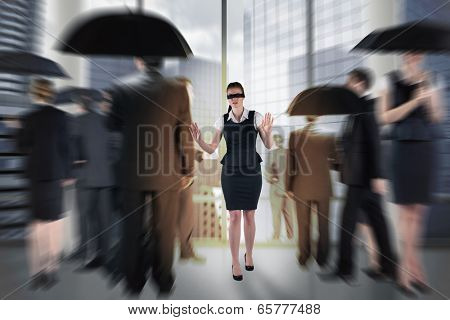 Redhead businesswoman in a blindfold against room with columns and view over city