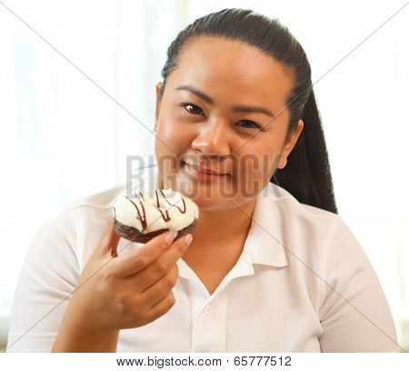 Woman Eating A Donut