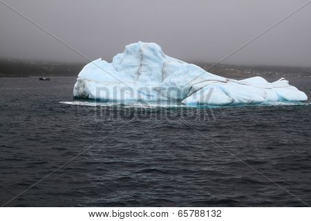 Iceberg In Bay Bulls, Newfoundland In Fogy Rainy Day.