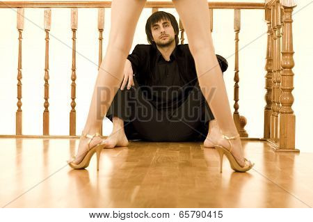 Man Watching Through Women's Legs