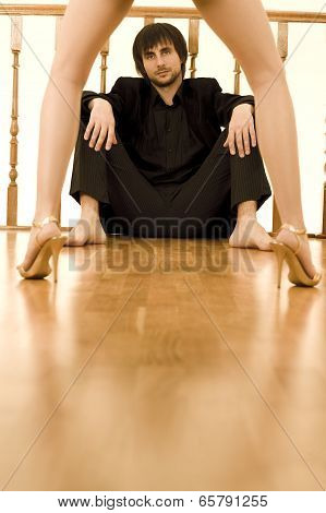 Man Watching Through Women's Legs