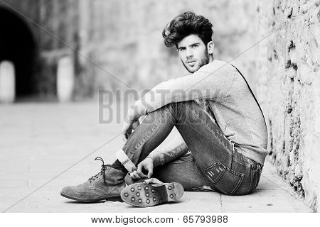 Man Wearing Suspenders In Urban Background