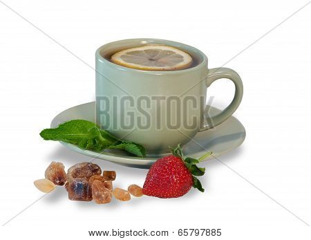 Tea Cup With Lemon, Mint, Cane Sugar Strowberry Isolated On White Background