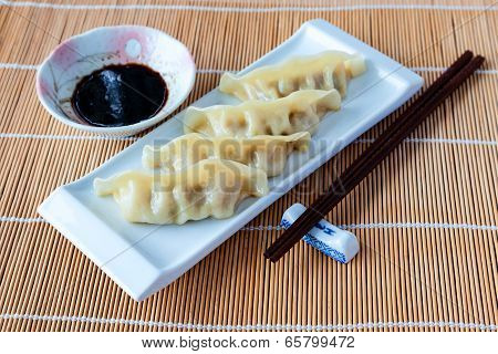 Delicious Gyoza Or Pot Stickers On Bamboo Mat