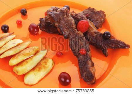 vegetable salad : cherry tomatoes and basil with sweet baked potato served on white plate with sauce boat full black soy sauce on wood high resolution hidef