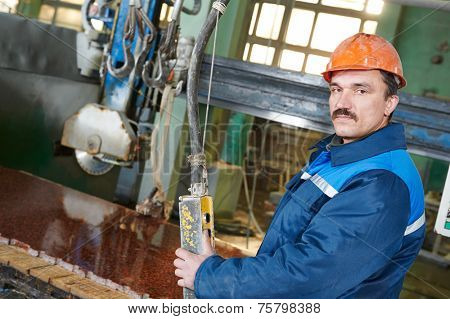industrial worker at factory on granite or marble manufactur?