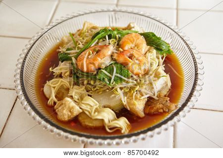 Lontong mie in Indonesian for its famous traditional food, or in English maybe spelled rice cake and noodle in vegetable soup