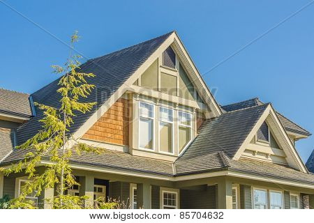 The roof of the house with nice window.