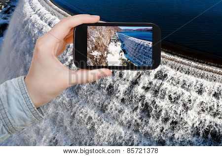 Tourist Photographs Of River Waterfall On Dam