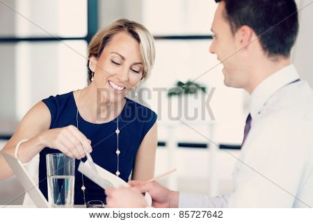 Businesswoman doing a presentaion in front of her collegues