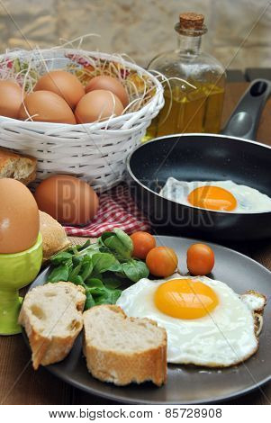 Fried Eggs With Bread And Oil