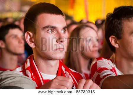 ZAGREB, CROATIA - JUNE 12, 2014: Portrait of worried young man wearing Croatian jersey at Ban Josip Jelacic square during the world cup match between Croatia and Brazil.