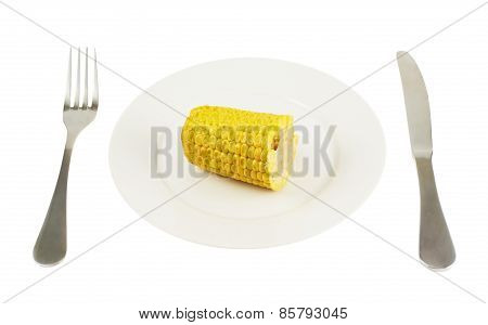 Plate with a piece of cornstick isolated