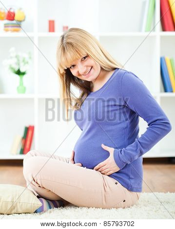 Happy pregnant woman smiling
