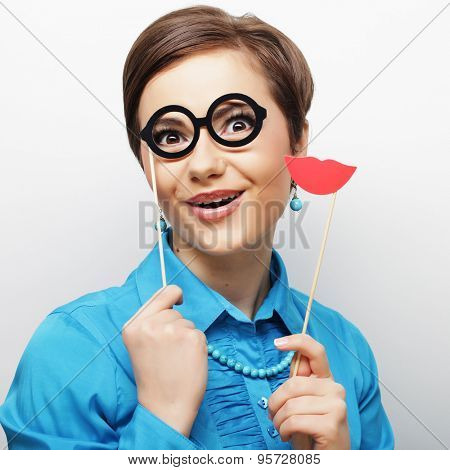 Attractive playful young woman ready for party - falce lips and glasses  