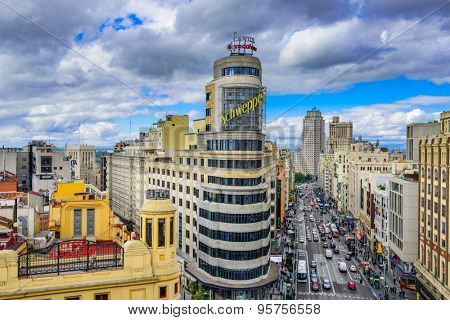 MADRID, SPAIN - OCTOBER 15, 2014: Gran Via at the Iconic Schweppes sign. The street is the main shopping district of Madrid.